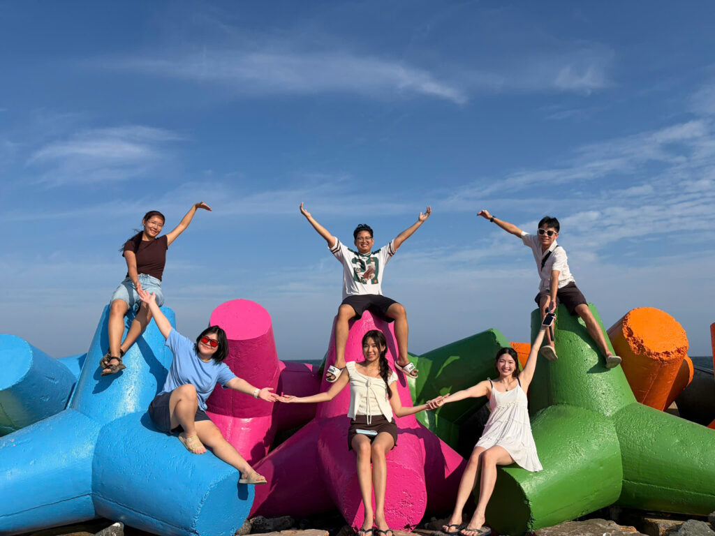 Tourists enjoying the ocean view at Ong Dia Rock Beach in Mui Ne. Ong Dia Rock Beach